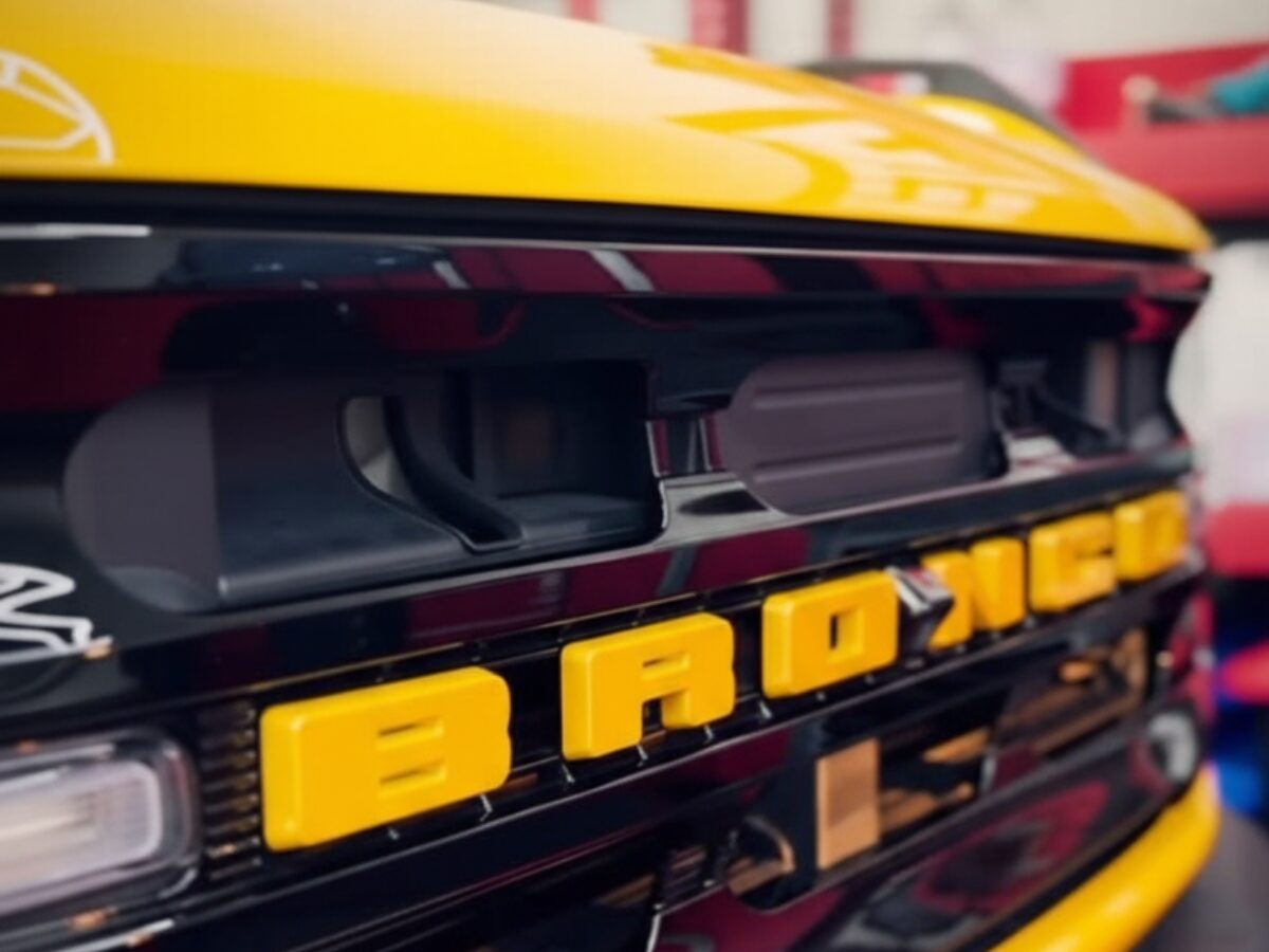 Yellow BRONCO grille close-up with bold branding | Icon Auto Lab